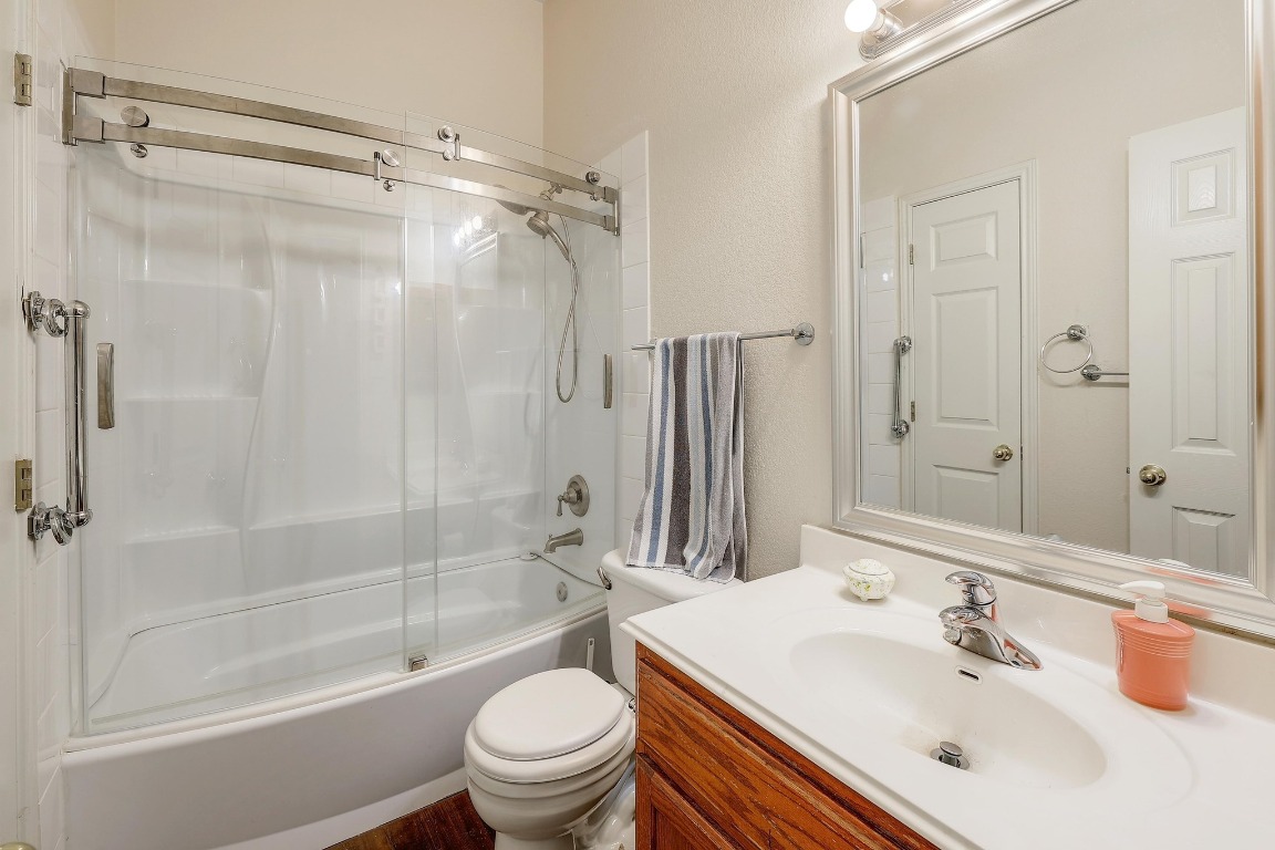 210 Buoy Circle Georgetown, TX 78633 - Photo 23 of 32 a bathroom with a sink mirror toilet and bathtub