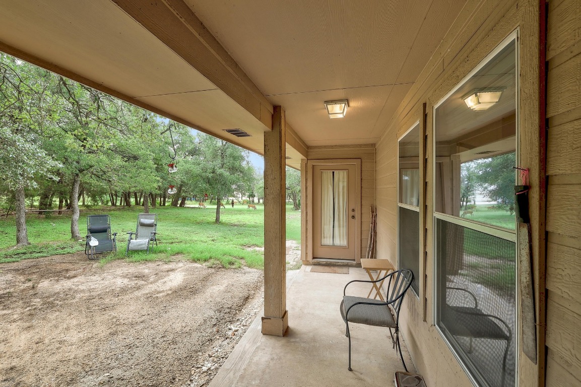 210 Buoy Circle Georgetown, TX 78633 - Photo 25 of 32 a view of a porch with chairs and backyard