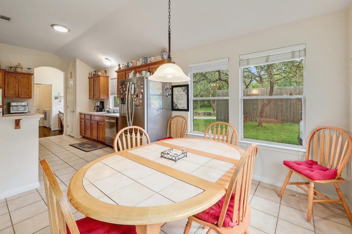 210 Buoy Circle Georgetown, TX 78633 - Photo 7 of 32 a dining room with furniture a chandelier and wooden floor