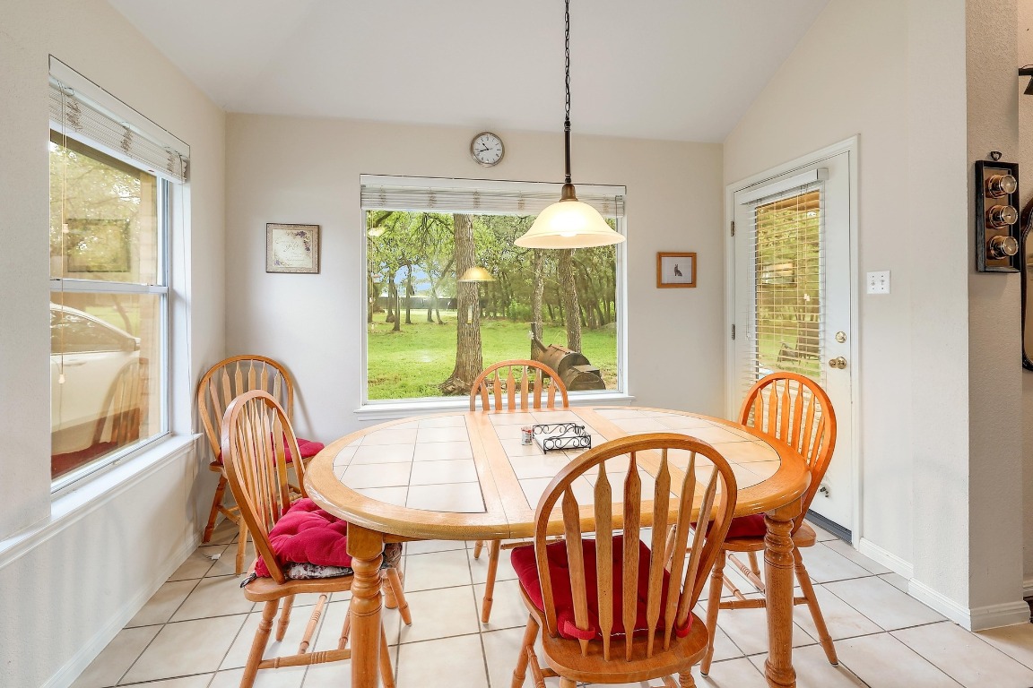 210 Buoy Circle Georgetown, TX 78633 - Photo 8 of 32 a dining room with furniture a chandelier and window