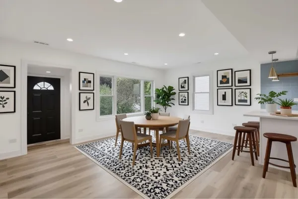 a view of a dining room with furniture window and wooden floor