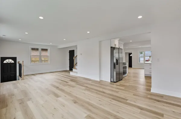 a view of a livingroom with wooden floor