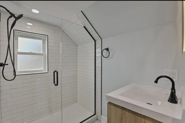 a bathroom with a sink and mirror