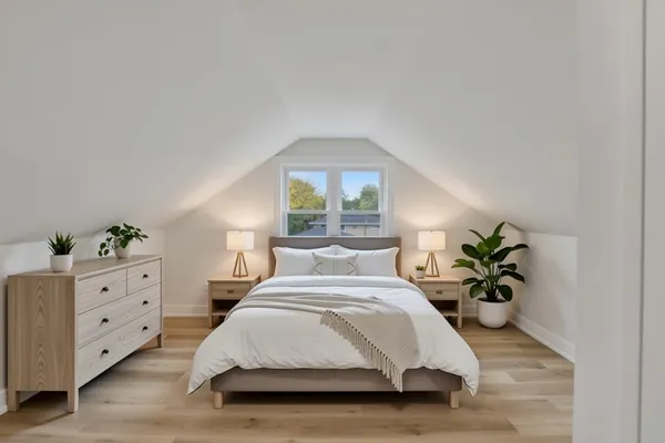 a bedroom with a bed and window