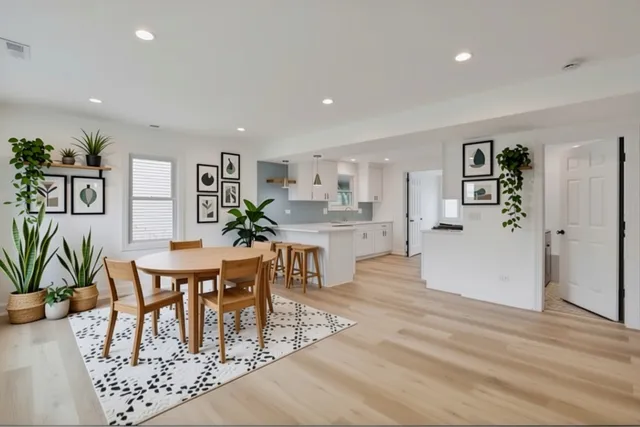 a view of a dining room with furniture and wooden floor