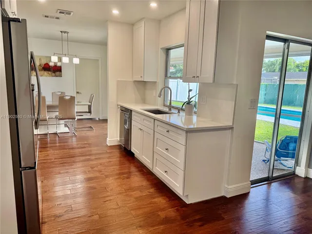 a view of an empty room with windows