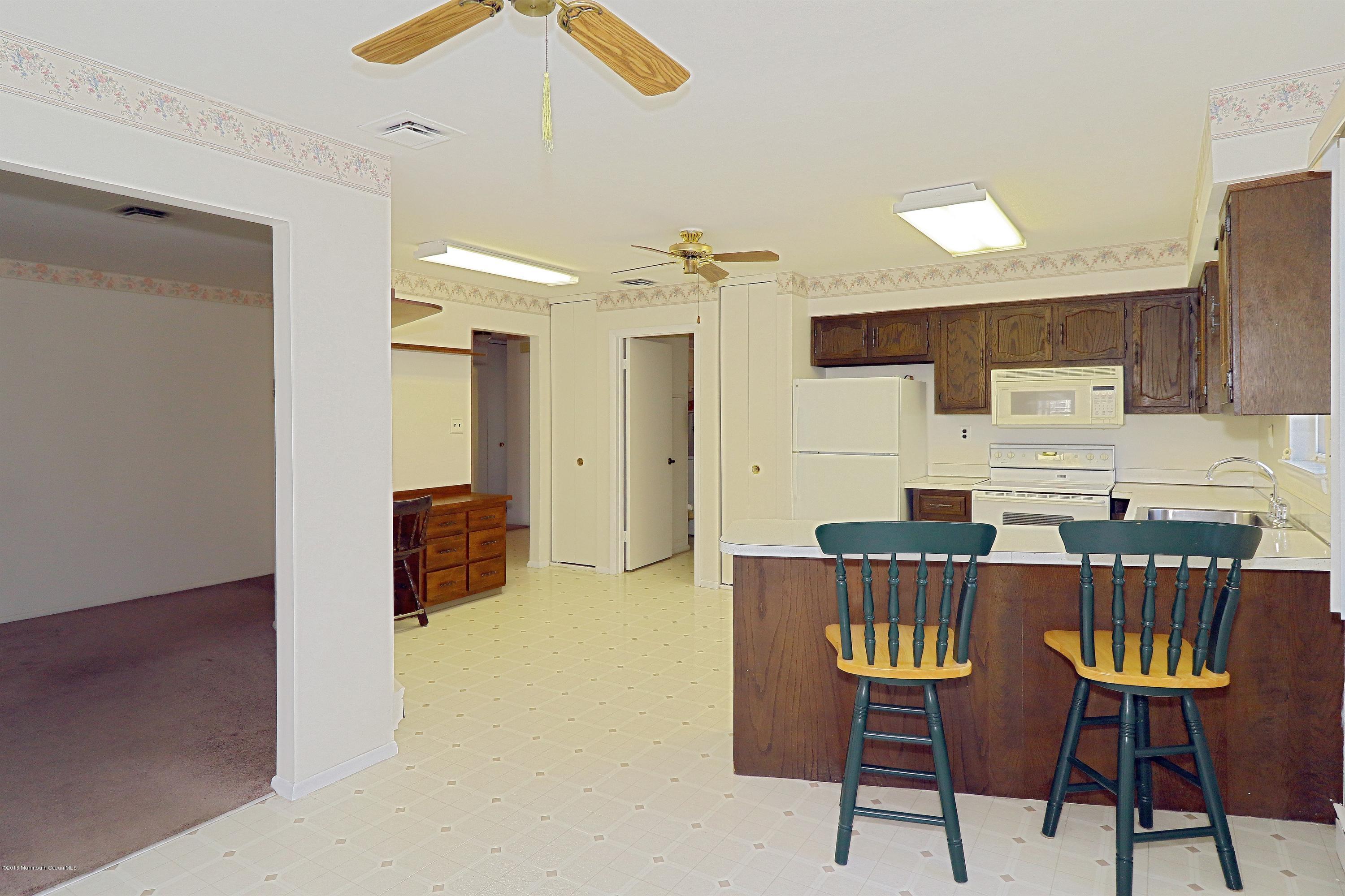 4 Markham Road Brick, NJ 08724 - Photo 9 of 28 a view of kitchen with furniture and wooden floor