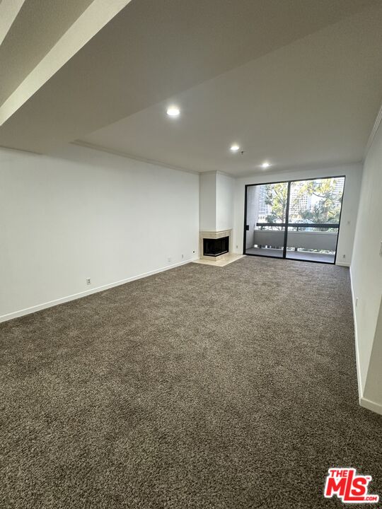 2122 Century Park Lane, Unit 312 Los Angeles, CA 90067 - Photo 5 of 44 a view of a kitchen with refrigerator and window
