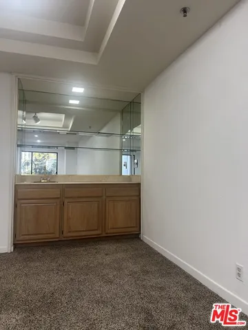 a room with window and cabinet
