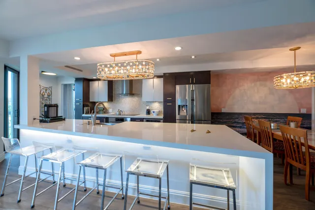 a large dining space with furniture and a large window