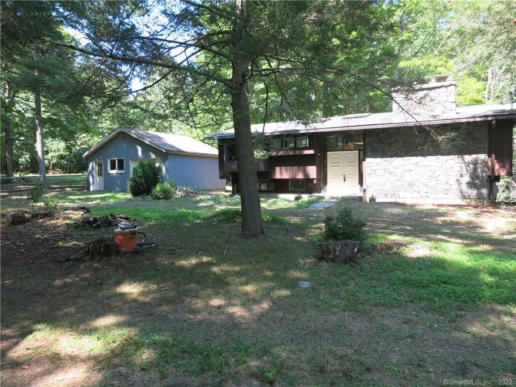215 Chestnut Hill Road Killingworth, CT 06419 - Photo 1 of 1 a front view of a house with garden