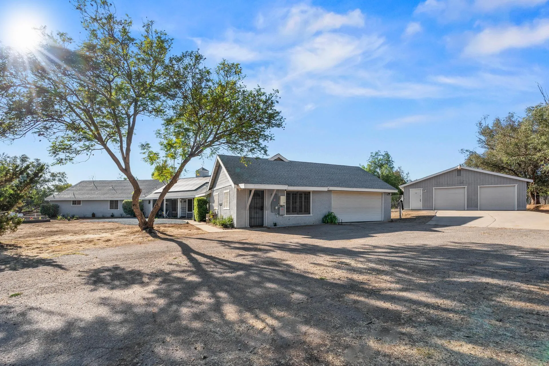 539 Steffy Road Ramona, CA 92065 - Photo 11 of 60 a front view of a house with a yard and trees