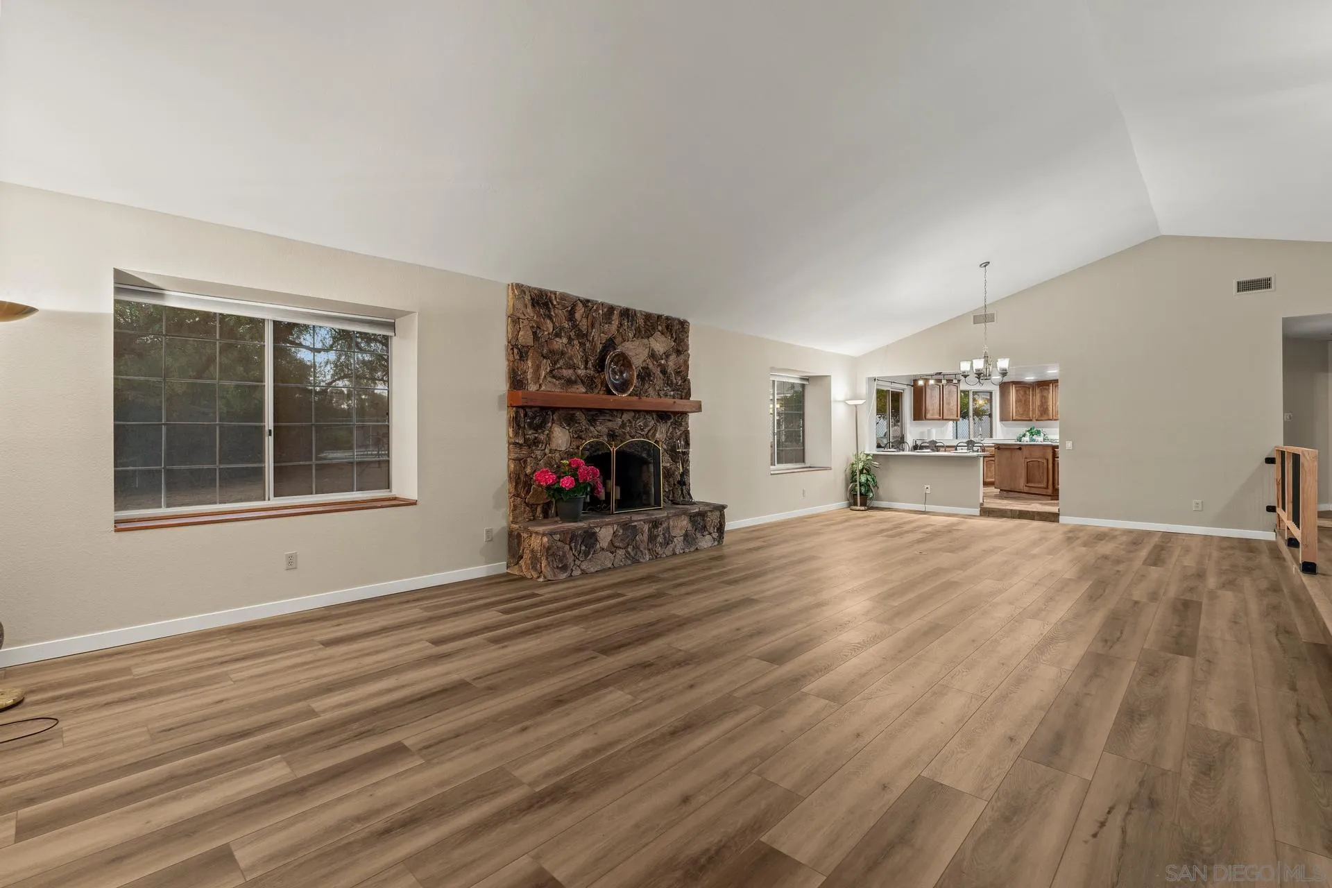 539 Steffy Road Ramona, CA 92065 - Photo 20 of 60 a view of a livingroom with a flat screen tv wooden floor and a window