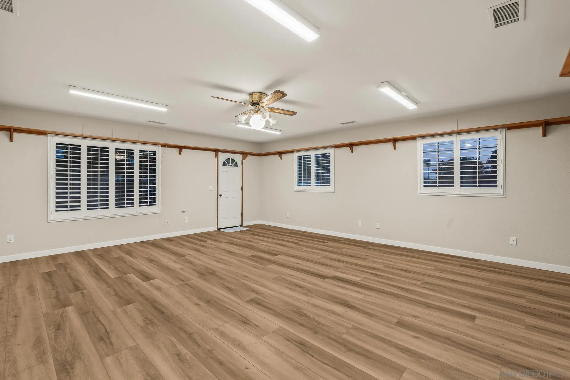 539 Steffy Road Ramona, CA 92065 - Photo 31 of 60 a view of an empty room with a window and wooden floor