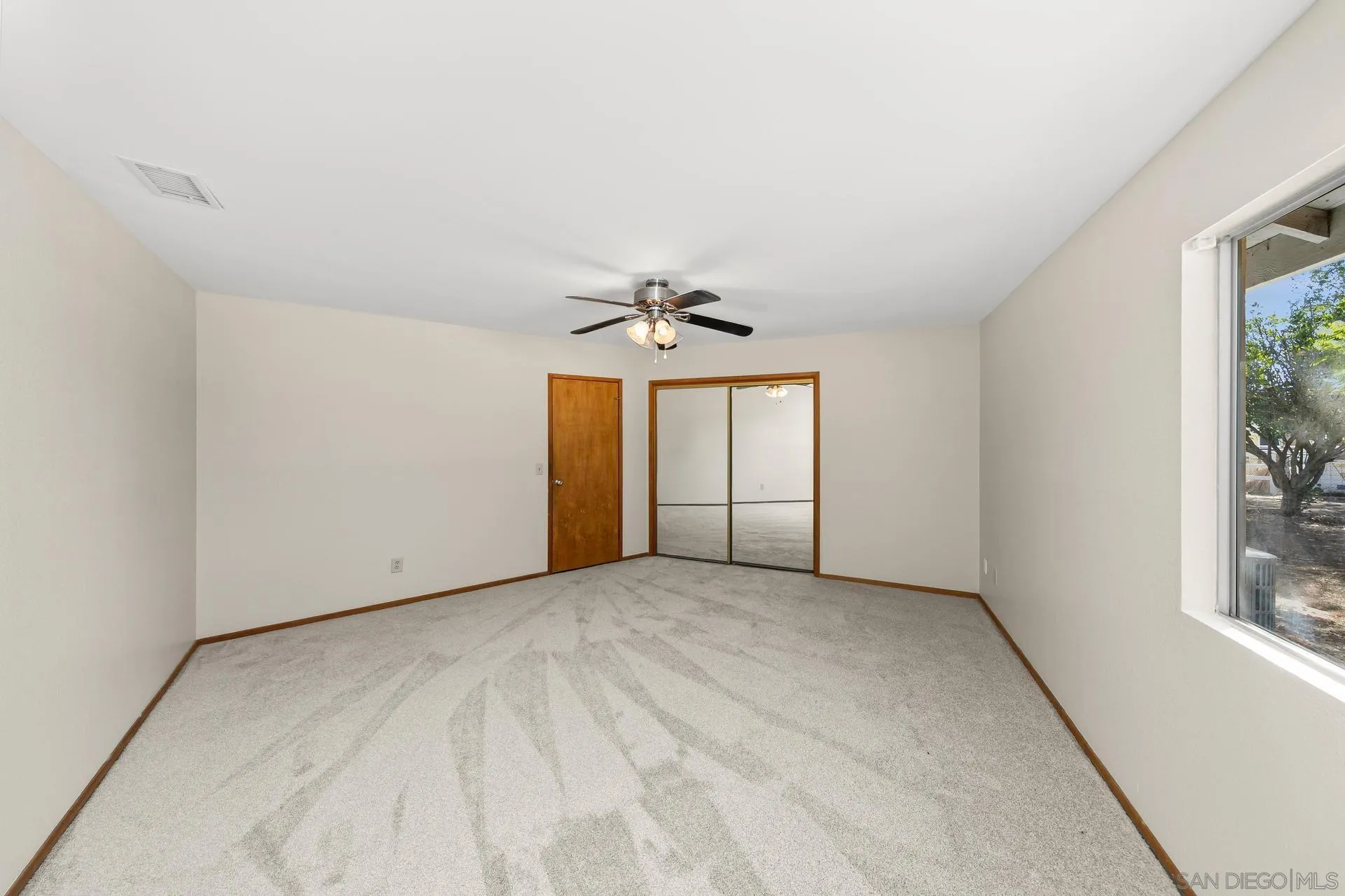 539 Steffy Road Ramona, CA 92065 - Photo 45 of 60 an empty room with windows and ceiling fan