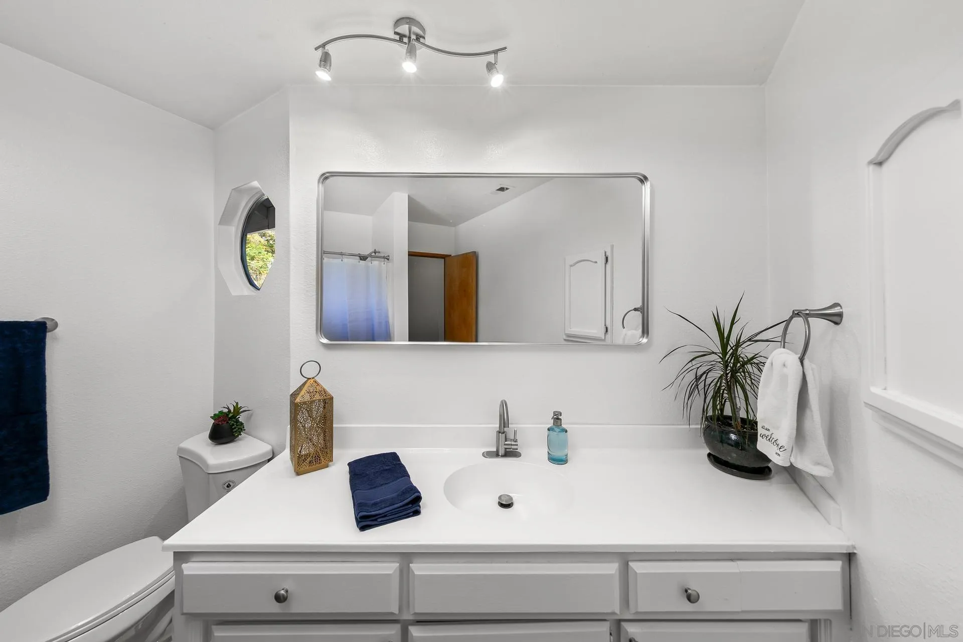 539 Steffy Road Ramona, CA 92065 - Photo 48 of 60 a bathroom with a sink and a mirror