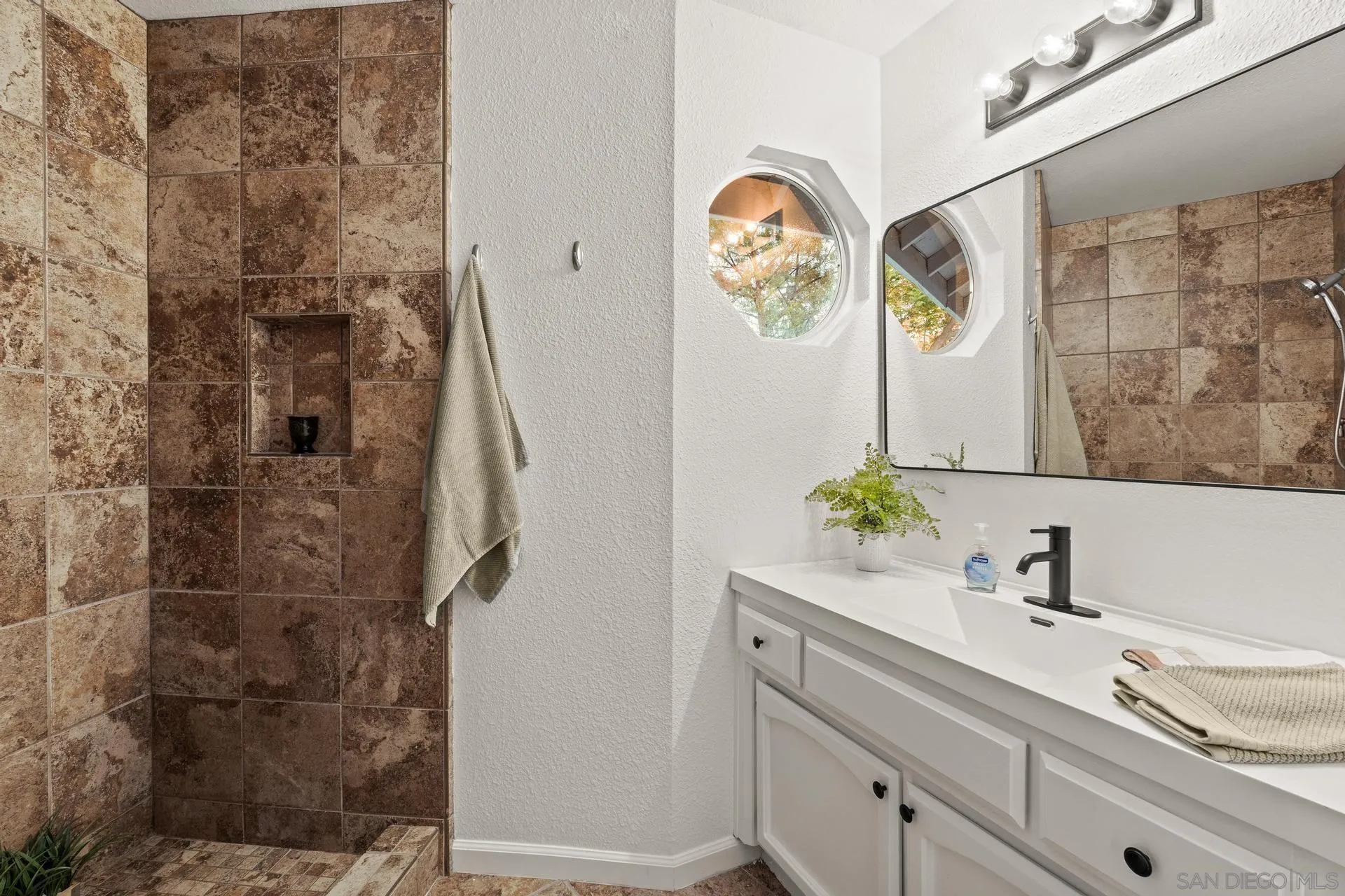 539 Steffy Road Ramona, CA 92065 - Photo 49 of 60 a bathroom with a sink and a mirror