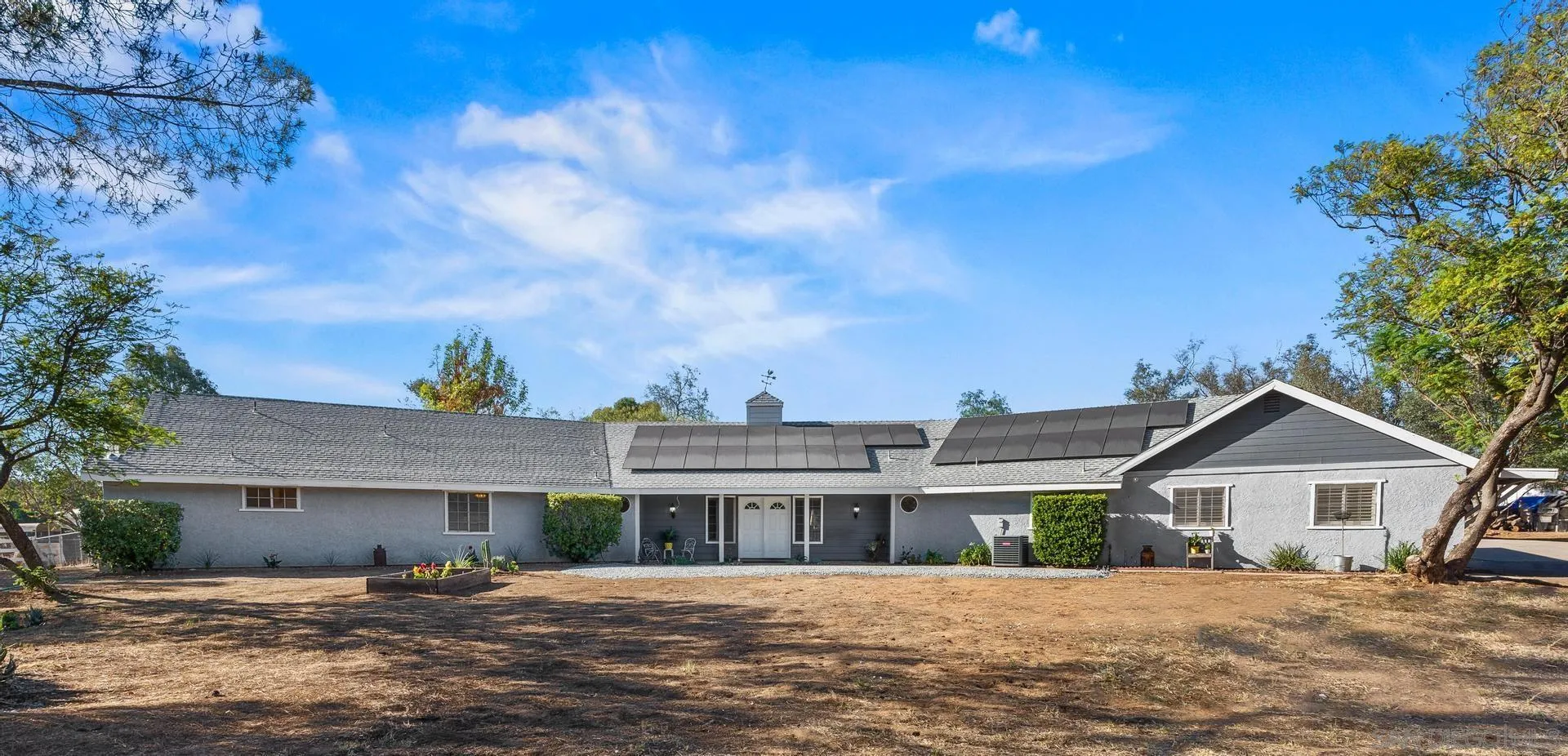539 Steffy Road Ramona, CA 92065 - Photo 10 of 60 a front view of a house with a garden