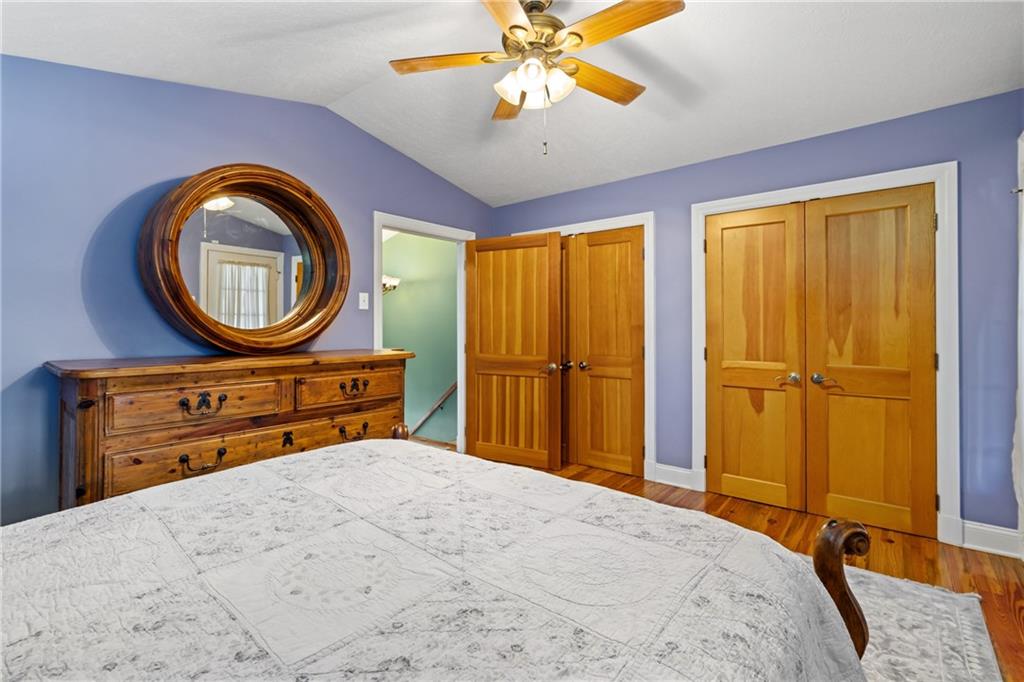 301 Kramer Way Pittsburgh, PA 15211 - Photo 22 of 32 a bedroom with a bed and a dresser