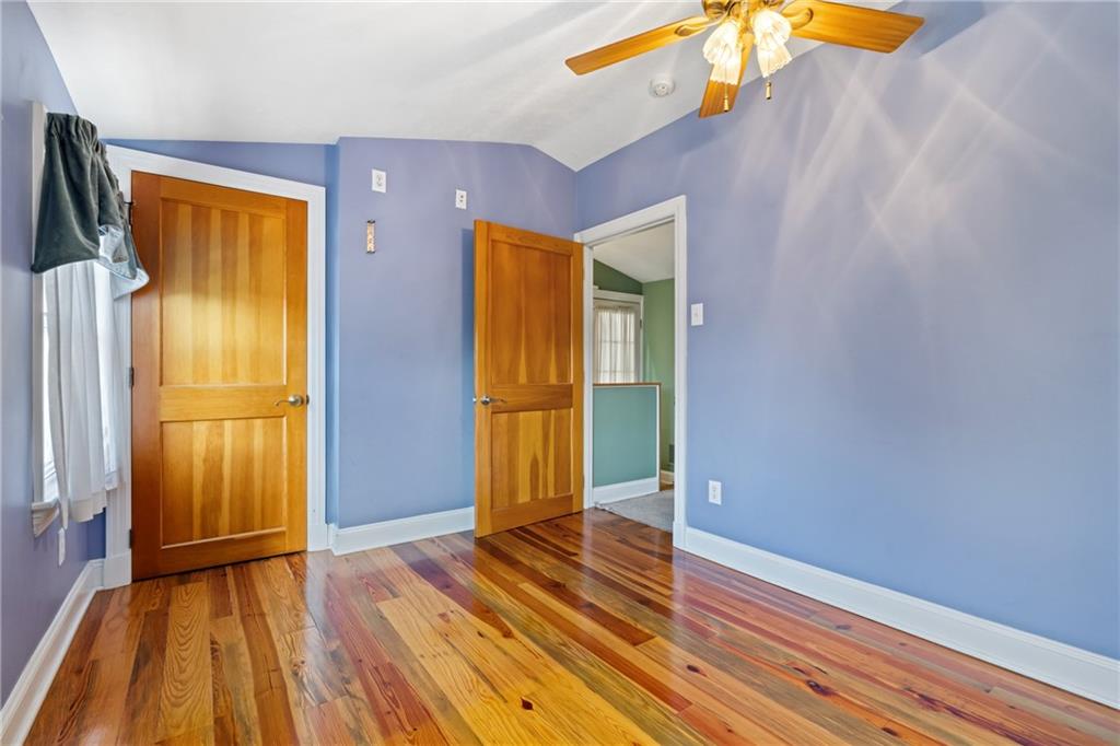 301 Kramer Way Pittsburgh, PA 15211 - Photo 25 of 32 a view of empty room with wooden floor and fan
