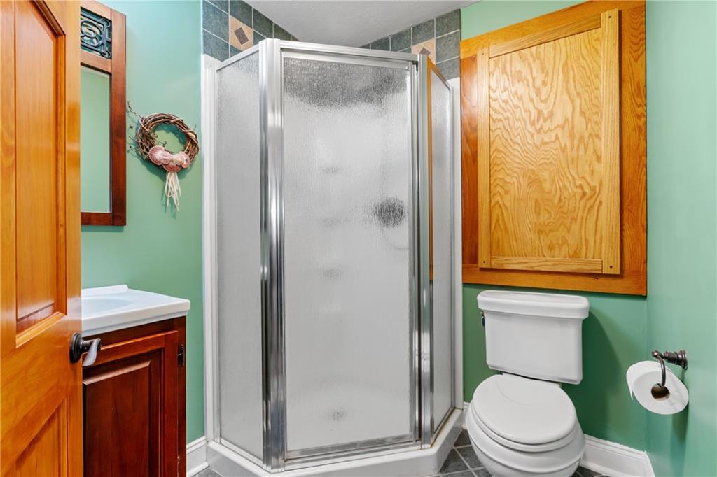 301 Kramer Way Pittsburgh, PA 15211 - Photo 26 of 32 a white toilet sitting next to a bathroom sink