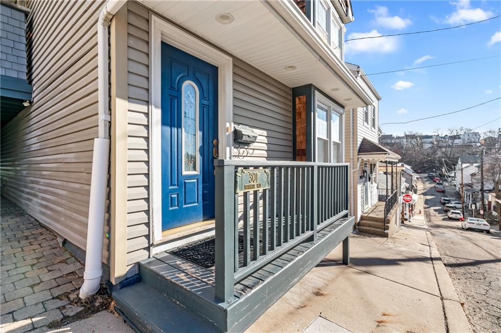301 Kramer Way Pittsburgh, PA 15211 - Photo 32 of 32 a view of a porch with a floor to ceiling window and wooden fence