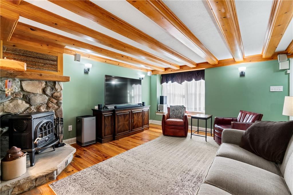 301 Kramer Way Pittsburgh, PA 15211 - Photo 5 of 32 a living room with furniture and a flat screen tv