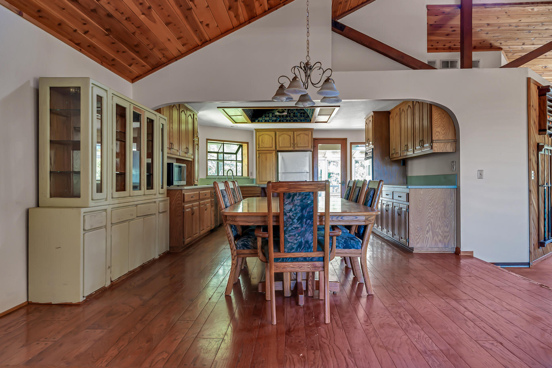 15368 Star Flower Road Oak Run, CA 96069 - Photo 27 of 63 a view of a dining room with furniture a chandelier and wooden floor