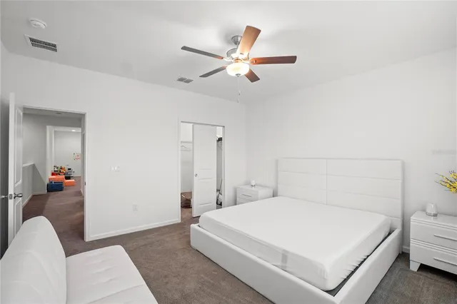 an aerial view of residential houses with outdoor space and ocean