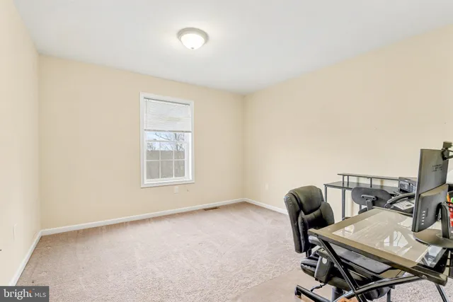 a workspace with furniture and a window