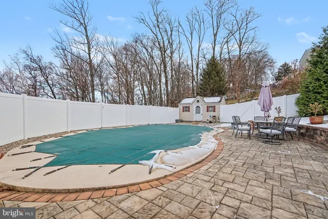 a view of a backyard with sitting area