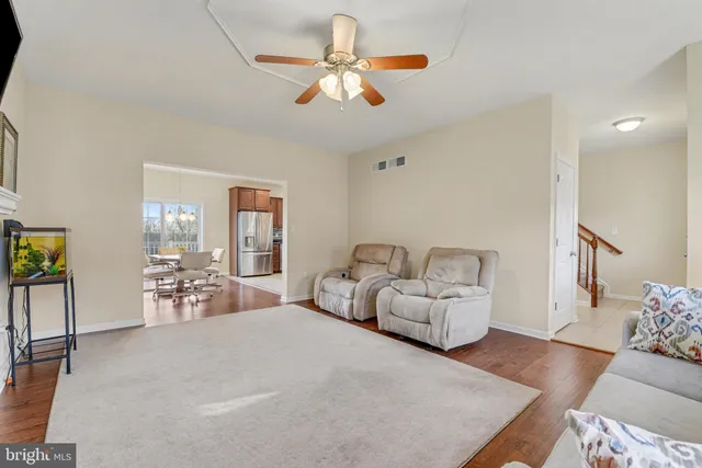 a bedroom with furniture and wooden floor