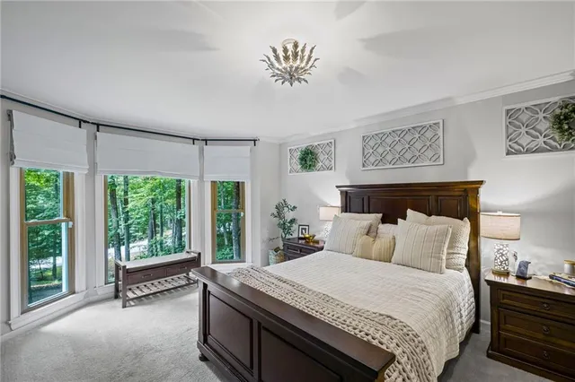 a bedroom with a balcony a bed and a couch