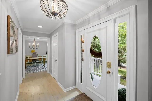a view of hallway with livingroom and furniture