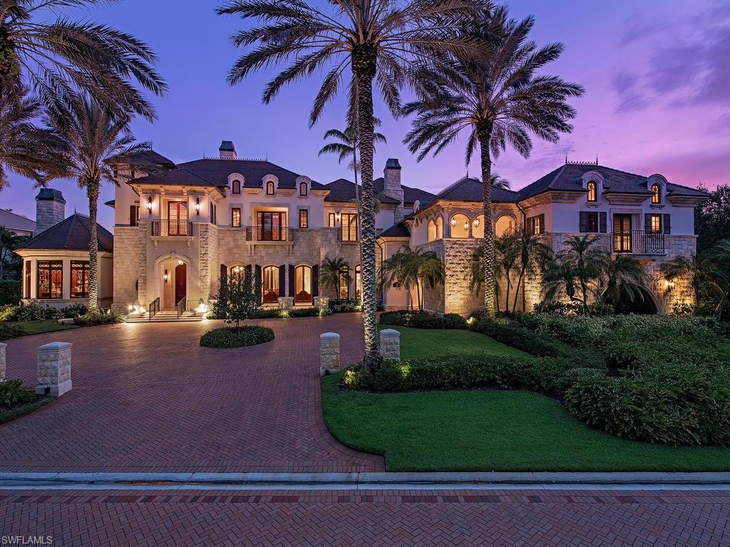 9766 Bent Grass Bend Naples, FL 34108 - Photo 1 of 35 a view of a street with houses
