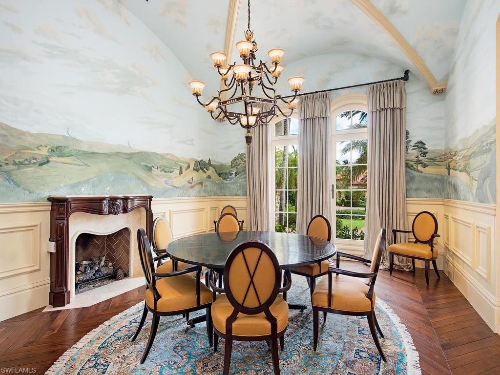 9766 Bent Grass Bend Naples, FL 34108 - Photo 11 of 35 a dining room with furniture water view and wooden floor