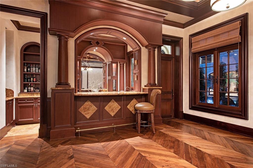 9766 Bent Grass Bend Naples, FL 34108 - Photo 15 of 35 a view of front door with stairs