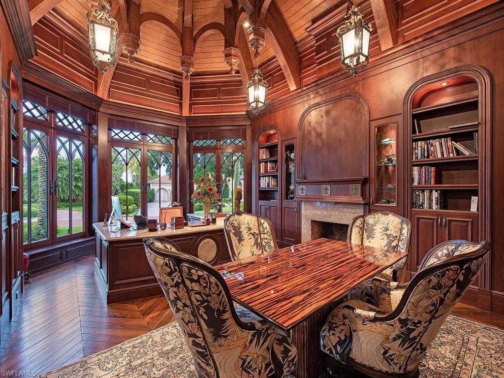 9766 Bent Grass Bend Naples, FL 34108 - Photo 18 of 35 a dining room with furniture wooden floor and window