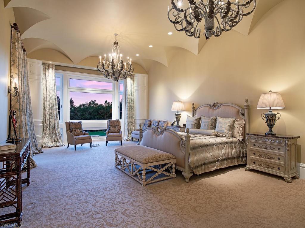 9766 Bent Grass Bend Naples, FL 34108 - Photo 20 of 35 a living room with furniture chandelier and a chandelier