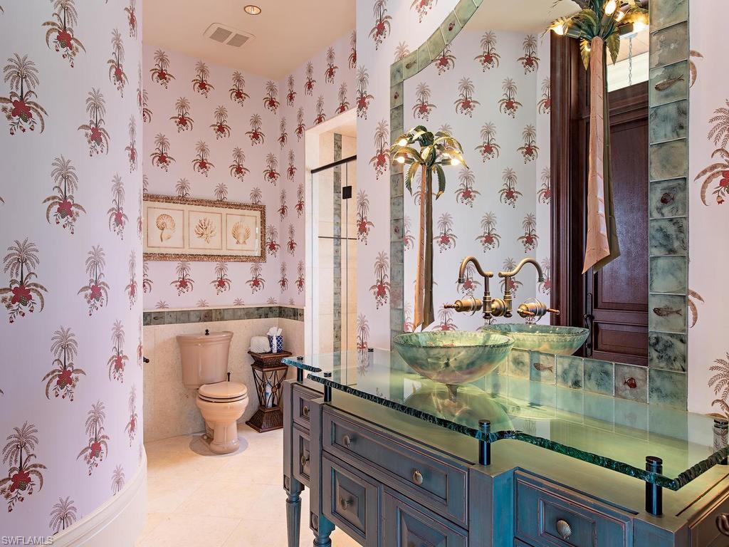 9766 Bent Grass Bend Naples, FL 34108 - Photo 25 of 35 a bathroom with a granite countertop sink and a mirror