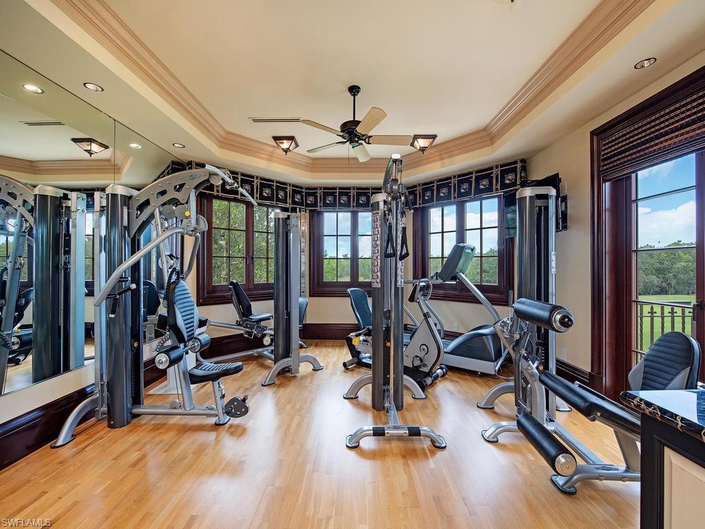 9766 Bent Grass Bend Naples, FL 34108 - Photo 28 of 35 a view of a room with gym equipment