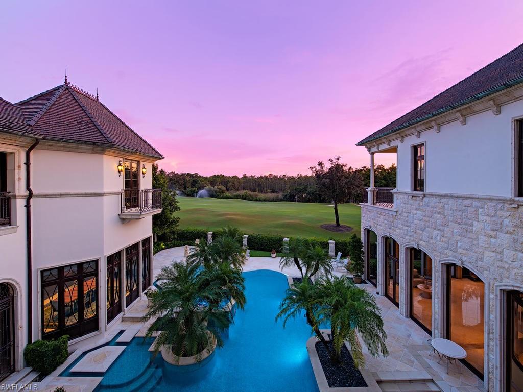 9766 Bent Grass Bend Naples, FL 34108 - Photo 3 of 35 a house view with a garden space