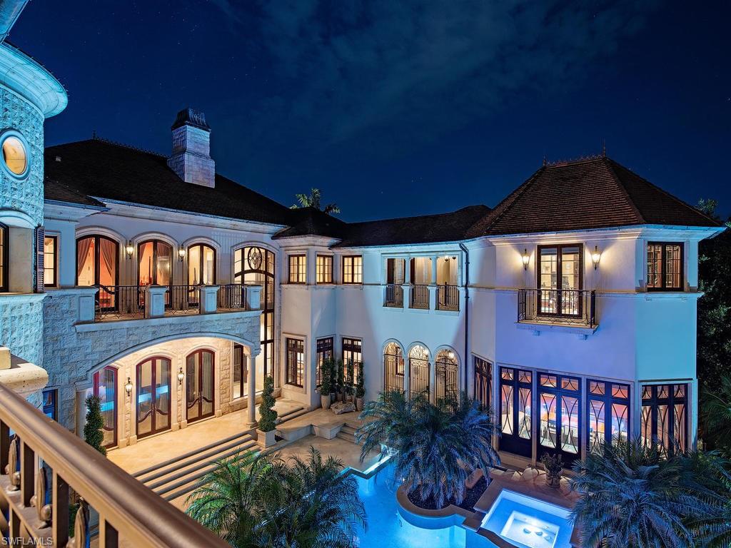 9766 Bent Grass Bend Naples, FL 34108 - Photo 31 of 35 a front view of a house with balcony