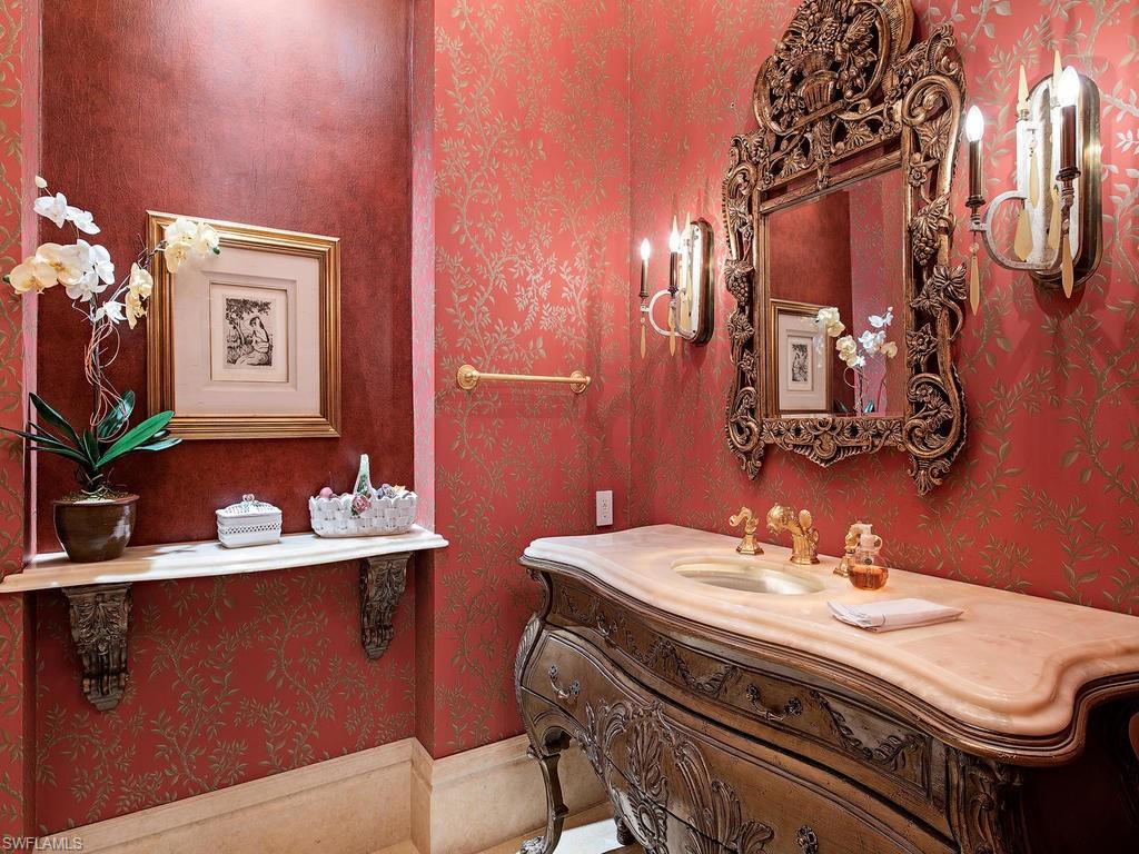 9766 Bent Grass Bend Naples, FL 34108 - Photo 35 of 35 a bathroom with a sink and a mirror