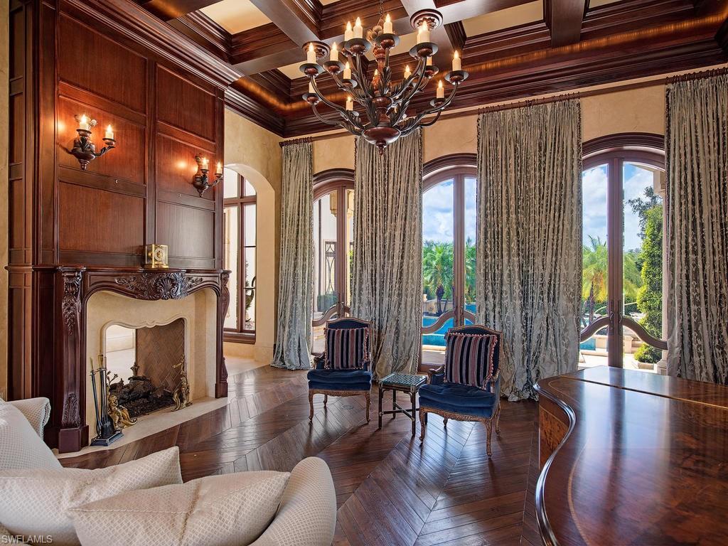 9766 Bent Grass Bend Naples, FL 34108 - Photo 7 of 35 a living room with furniture and a fireplace