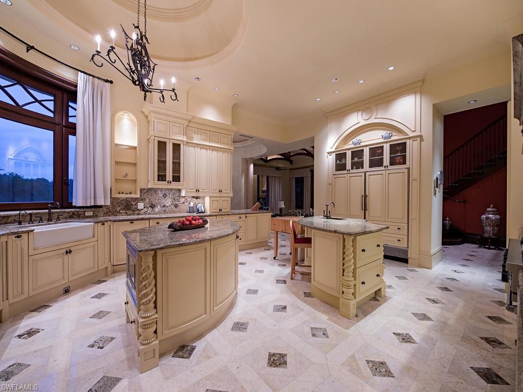 9766 Bent Grass Bend Naples, FL 34108 - Photo 9 of 35 a kitchen with a sink and cabinets