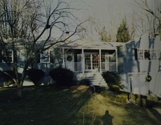 2539 Boston Post Road Darien, CT 06820 - Photo 1 of 1 a front view of a house with a yard