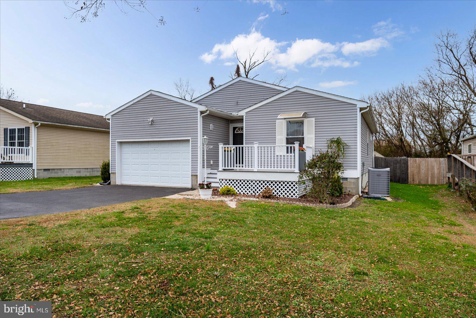 36405 Poplar Neck Road Willards, MD 21874 - Photo 2 of 50 a front view of house with yard and garage