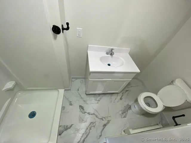 an empty room with wooden floor and closet