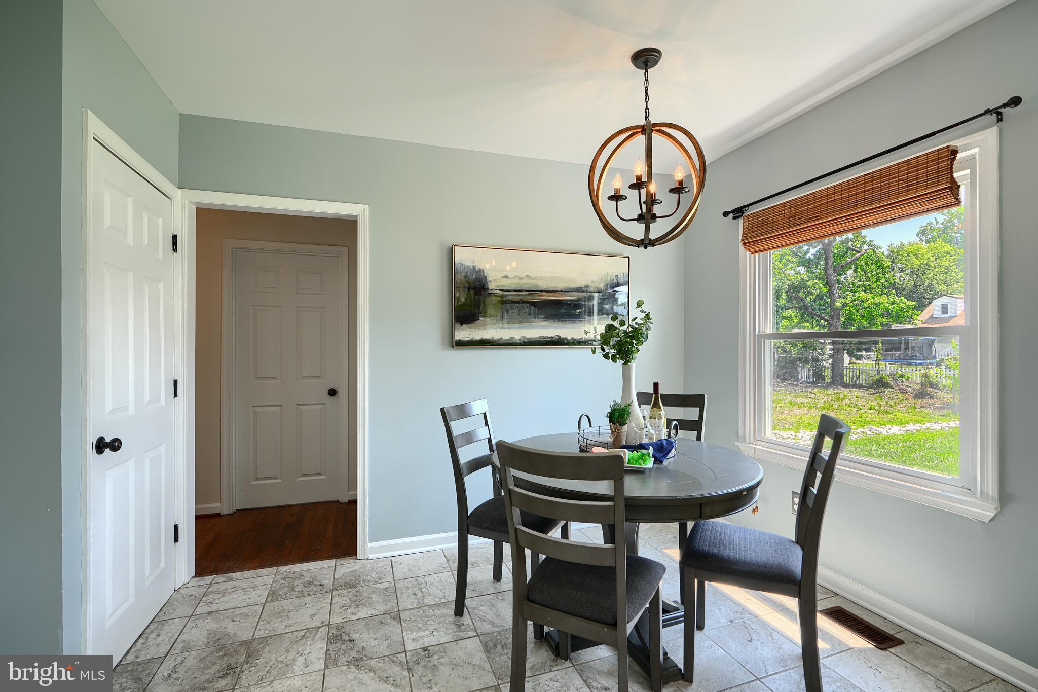 2903 Sparrows Point Road Sparrows Point, MD 21219 - Photo 11 of 57 a dining room with furniture window and wooden floor